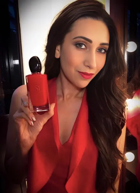 Woman in red holding product